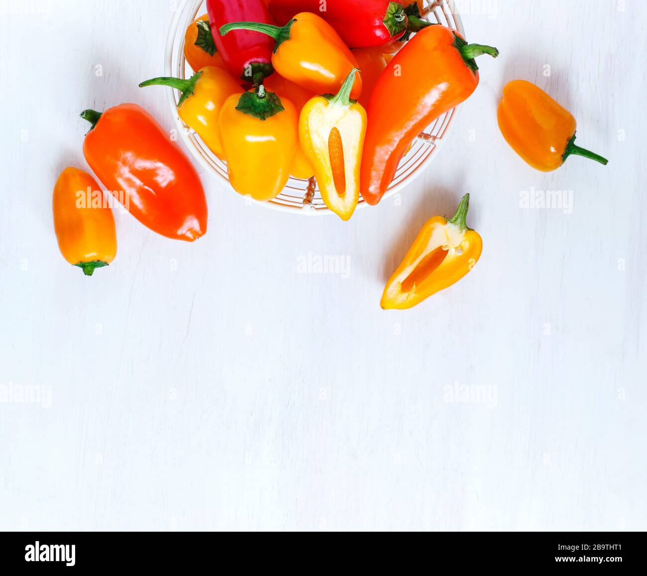 Sweet mini peppers sorted by color, top view Stock Photo - Alamy