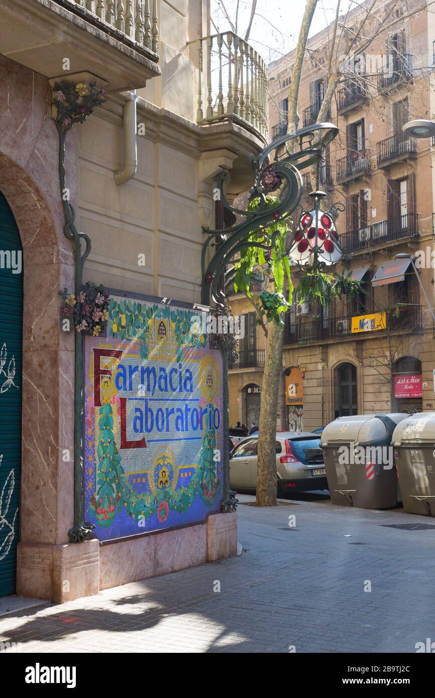 Barcelona, Spain - February 23, 2020: Art nouveau lamp and tiles Farmacia  Laboratorio, corner of Carrer del Bruc and Ronda de Sant Pere Stock Photo -  Alamy