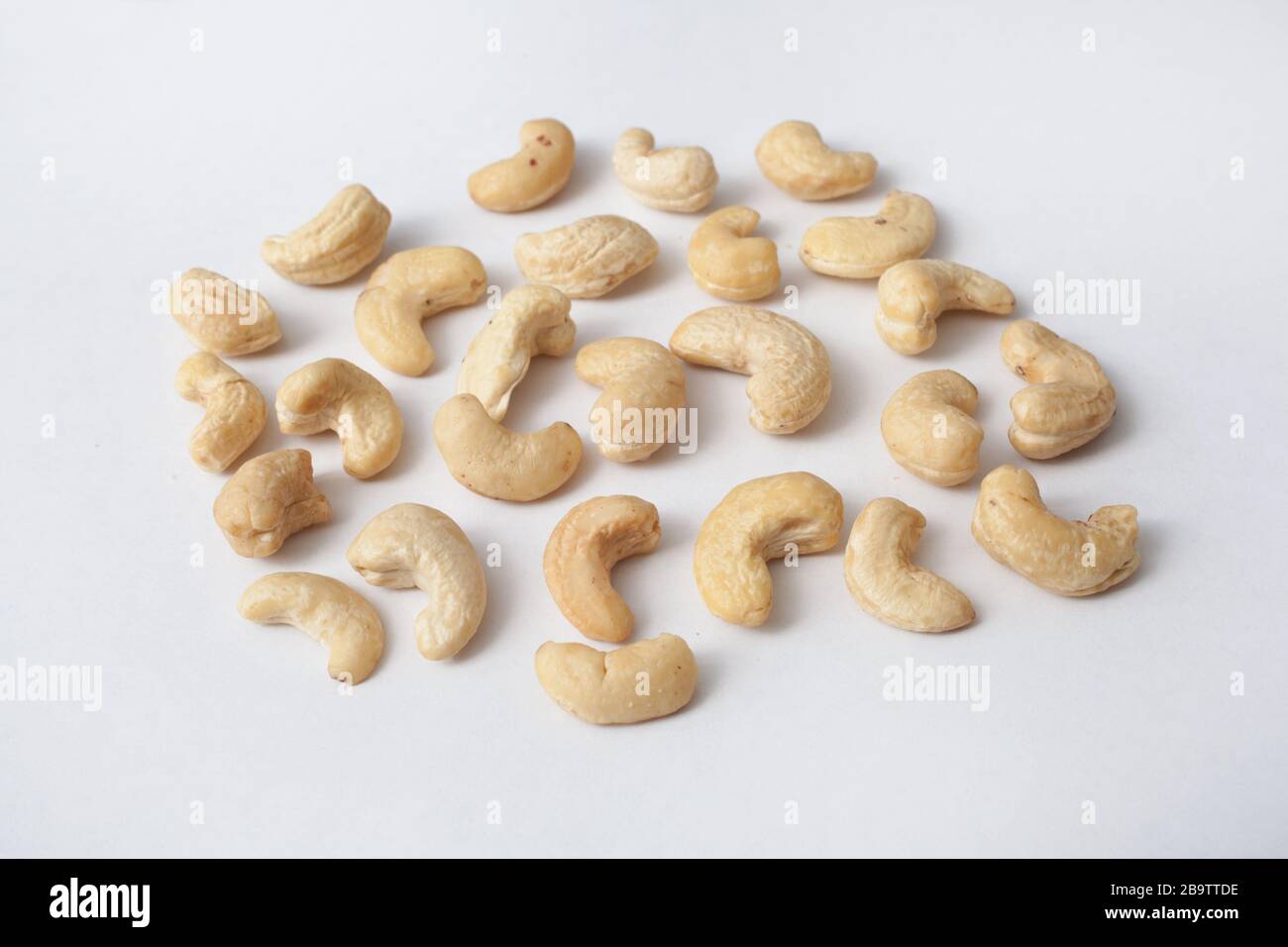 Cashew nuts against a white background Stock Photo