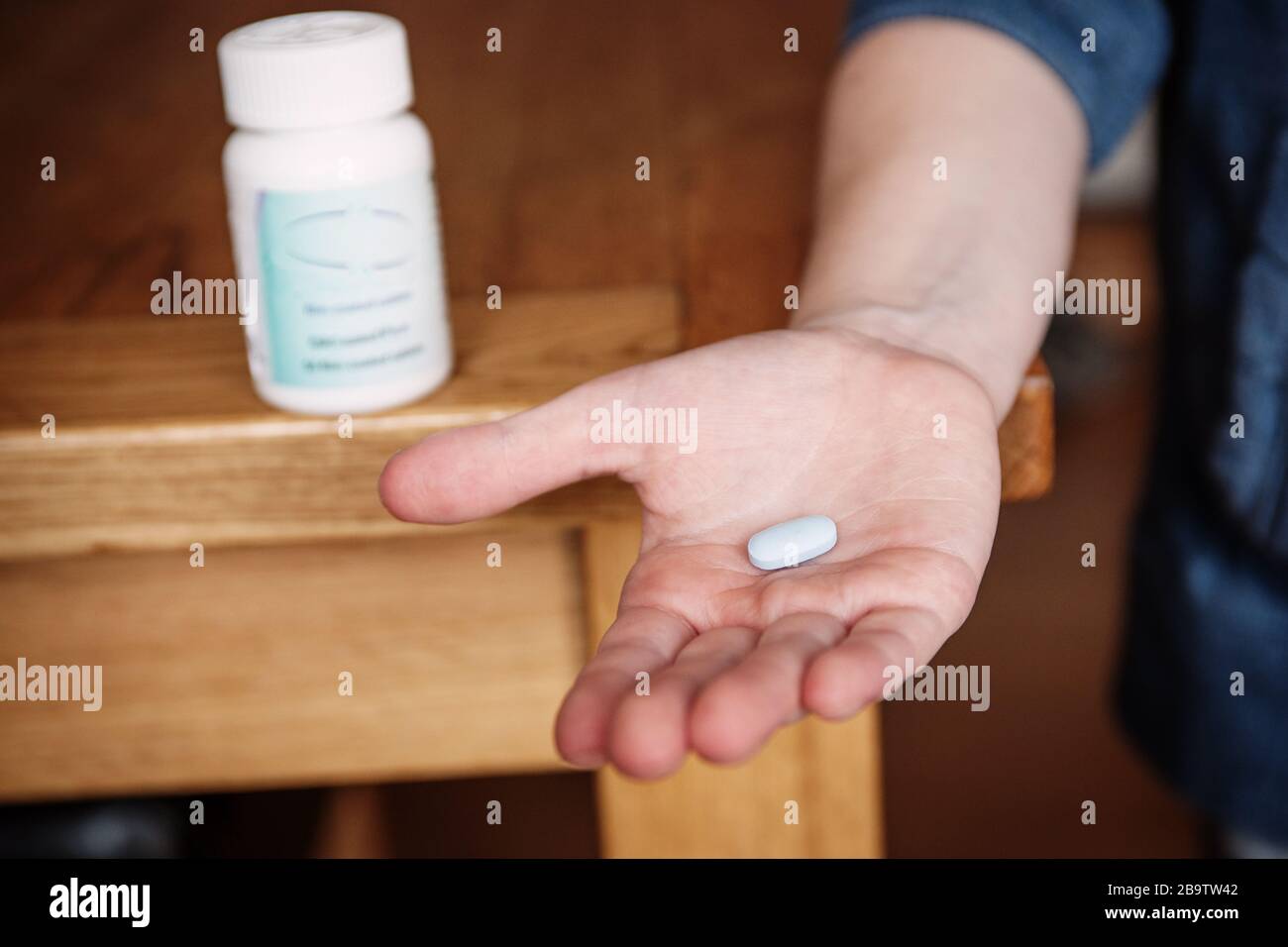 hand holding medicinal pill Stock Photo