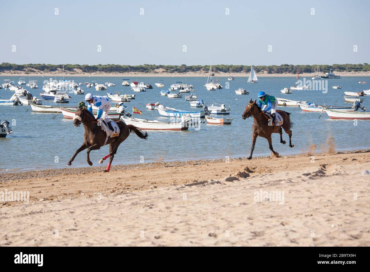 The annual August horserace meeting run on the beach at Sanlucar de Barrameda, Cadiz, Spain. 3rd August 2017. Stock Photo