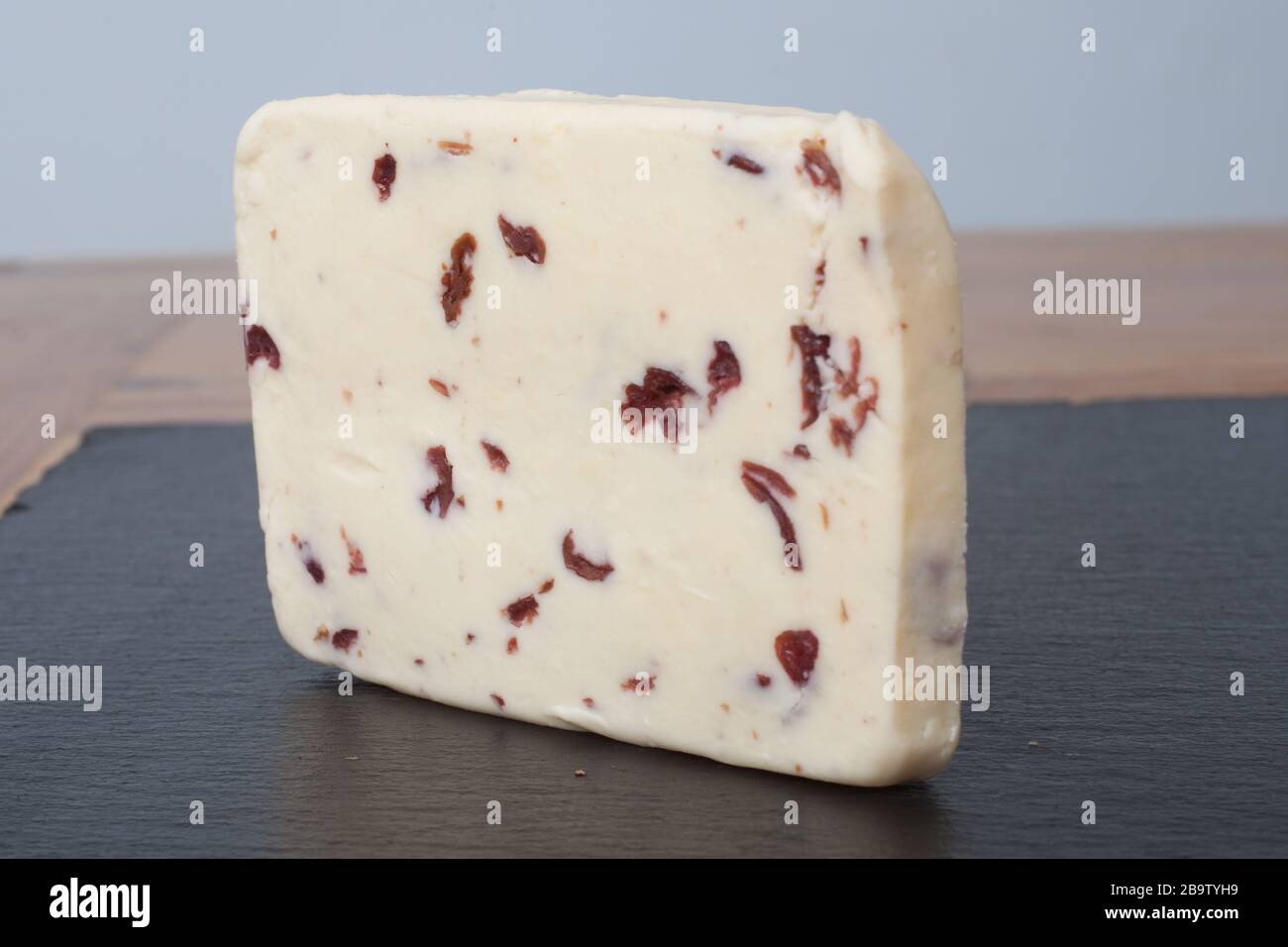 A slice of British Wensleydale and Cranberry cheese Stock Photo