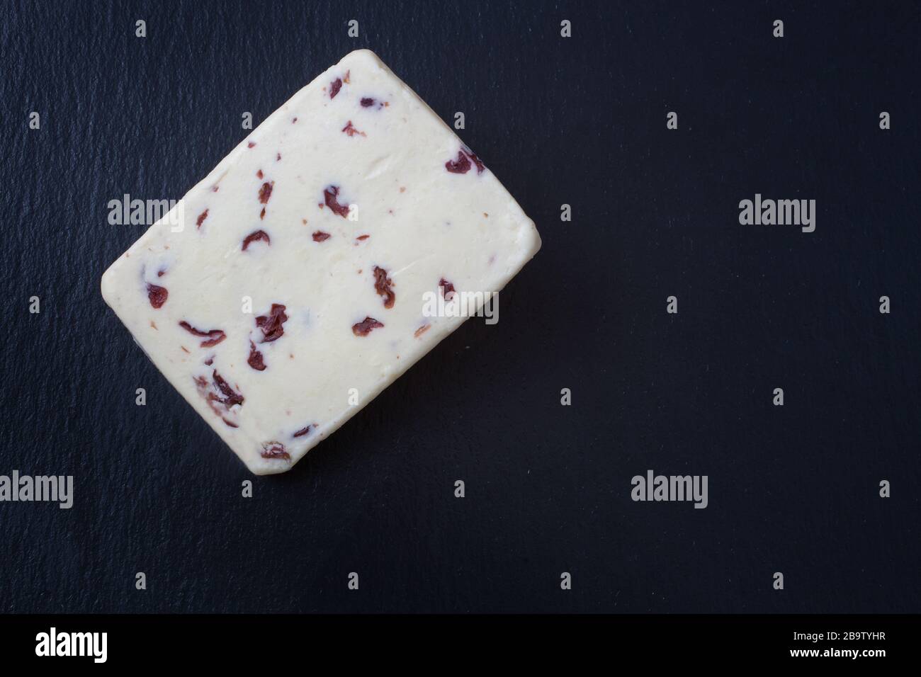 A slice of British Wensleydale and Cranberry cheese Stock Photo