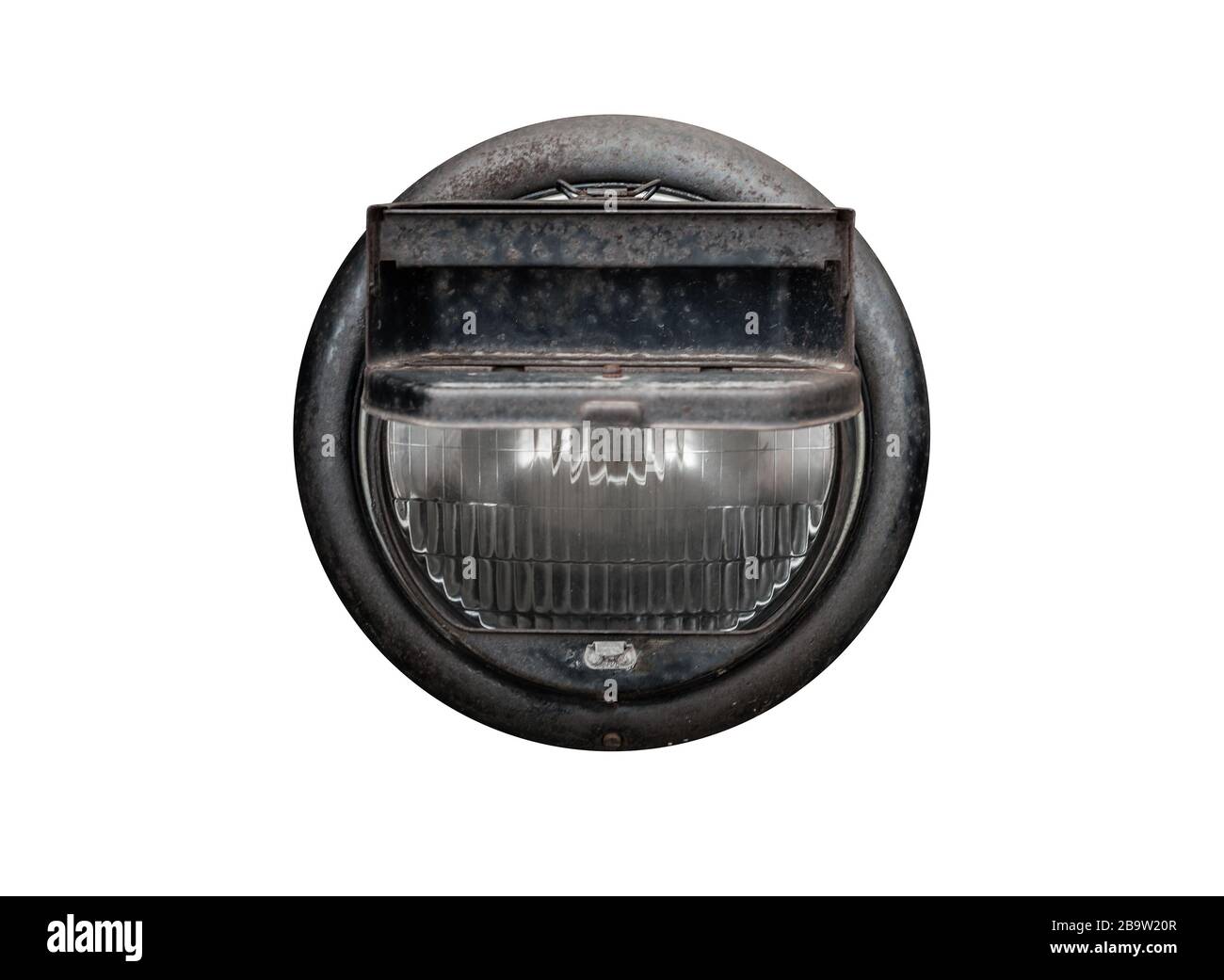 Headlight of a military truck with blackout headlight cover isolated on white background Stock Photo