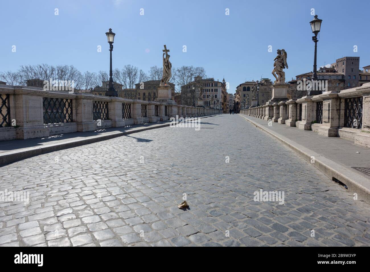 ROME, ITALY - 12 March 2020: the popular tourist spot of the Saint'Angelo bridge is now deserted, a rare sight in Rome, Italy. Today, the Italian gove Stock Photo