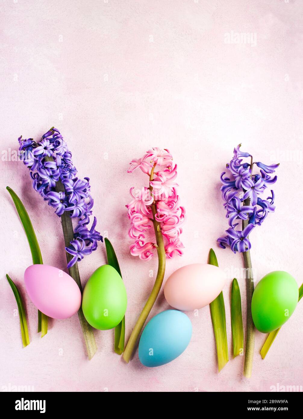 Spring Easter background with flowers and decoration eggs, copy space Stock Photo