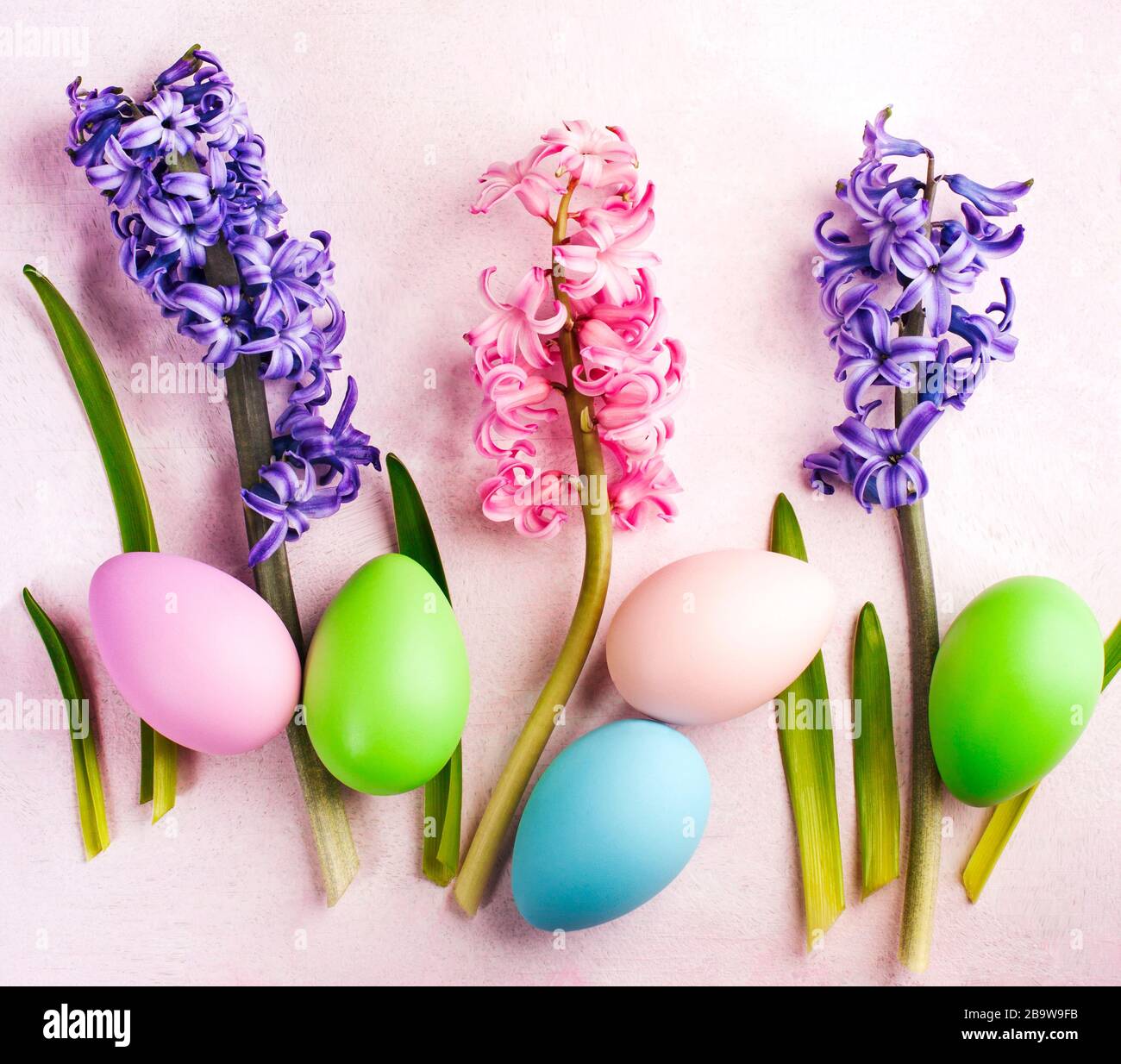 Spring Easter background with flowers and decoration eggs, copy space Stock Photo