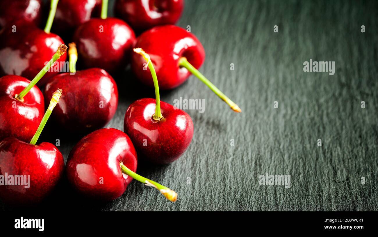 Sweet cherries on dark background Stock Photo