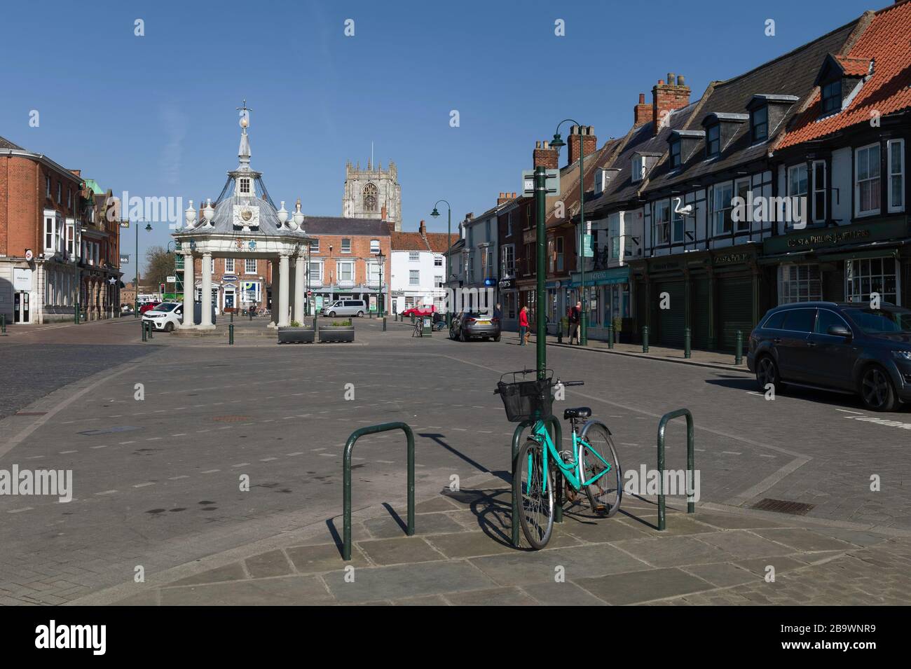 Town centre with businesses and shops closed and few people after Government decree following Corona virus scare in spring Stock Photo
