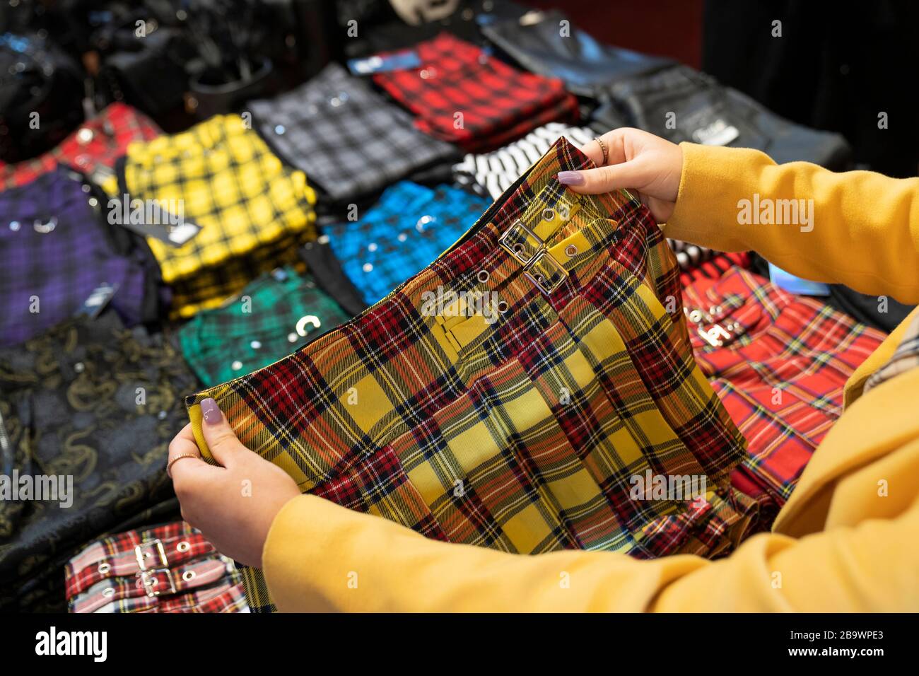 Yellow tartan kilt for sale in tartan shop. Stock Photo