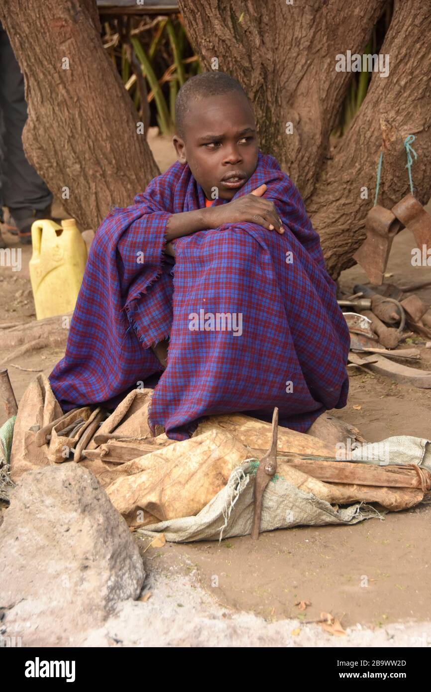 Young boy, embers of the Datoga tribe sitting. Photographed in Lake Eyasi Tanzania Stock Photo