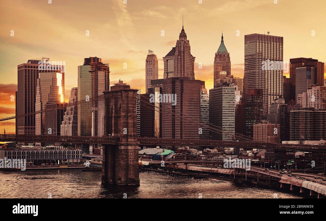 Manhattan and Brooklyn Bridge at sunset, color toning applied, New York City, USA. Stock Photo