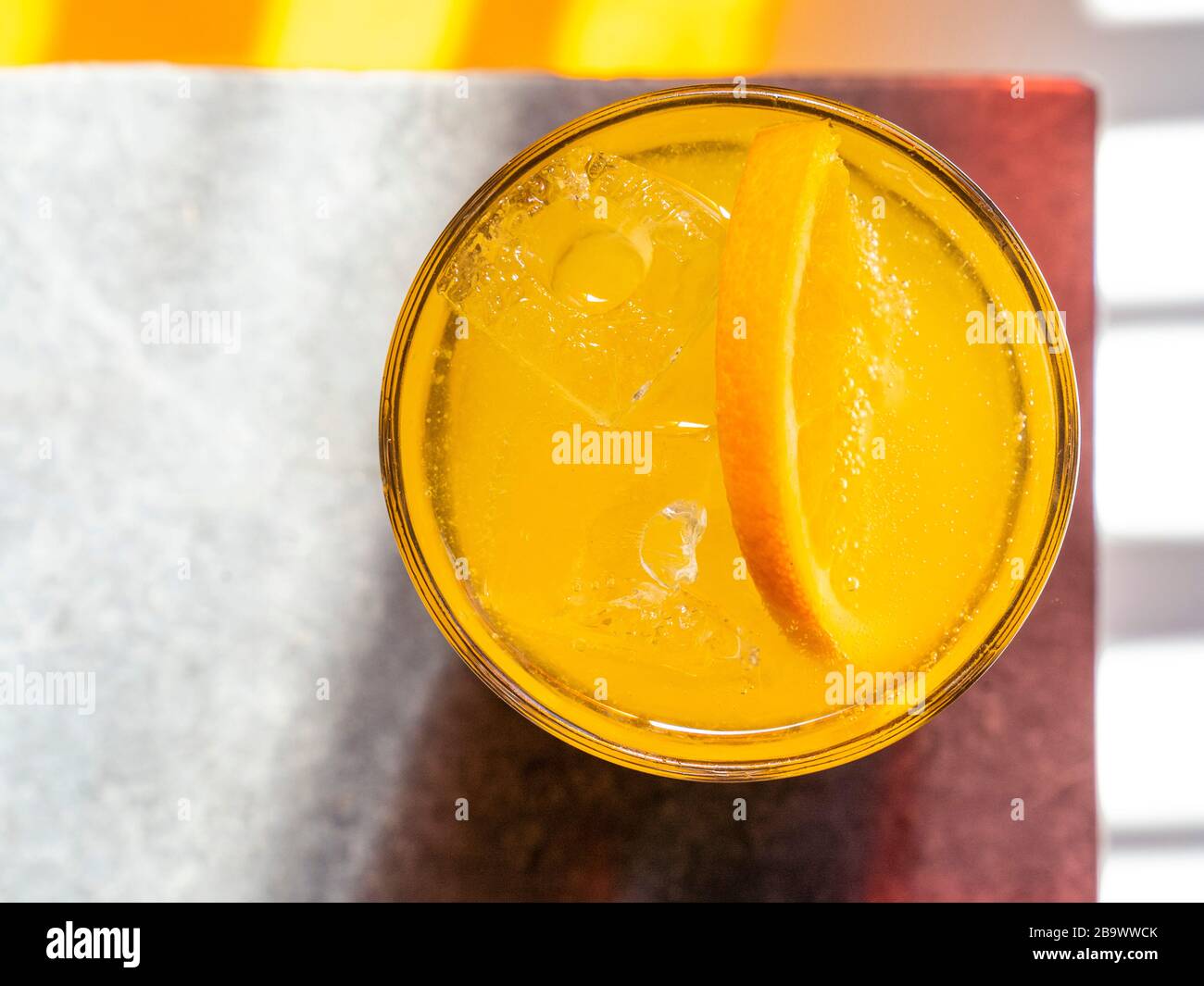 Screwdriver cocktail - vodka and orange in sunlight. Stock Photo
