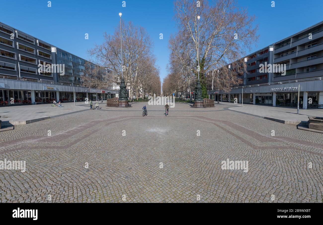 25 March 2020, Saxony, Dresden: Almost deserted is the pedestrian zone and shopping mile 'Hauptstraße'. To contain the coronavirus, Saxony now prohibits all gatherings of three or more people in public. Photo: Robert Michael/dpa-Zentralbild/dpa Stock Photo