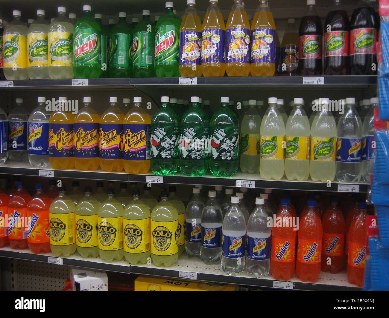 Soft drinks on shelves in a Woolworths supermarket (en:Australia). Taken by 6 October 2006 (original upload date); Transferred from en.wikipedia to Commons.; SMC at English Stock Photo - Alamy