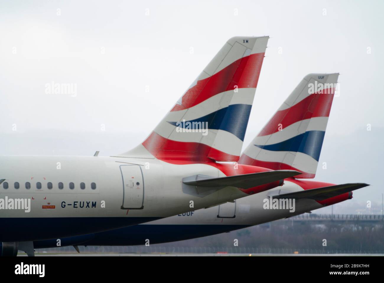 Glasgow, Scotland, UK. 25 March, 2020. Day two of the Government enforced lockdown in the UK. All shops and restaurants and most workplaces remain closed. Cities are very quiet with vast majority of population staying indoors. Pictured; British Airways passenger aircraft remain grounded and parked at Glasgow Airport. Iain Masterton/Alamy Live News Stock Photo