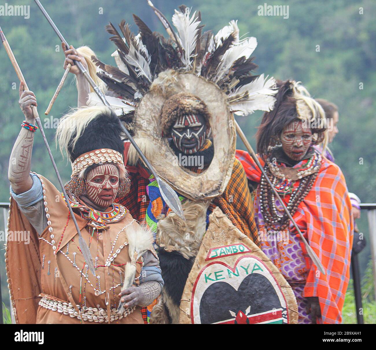 Kikuyu warriors wearing headdress made of bird's feathers. Photographed at Thomson's Falls Kenya Stock Photo