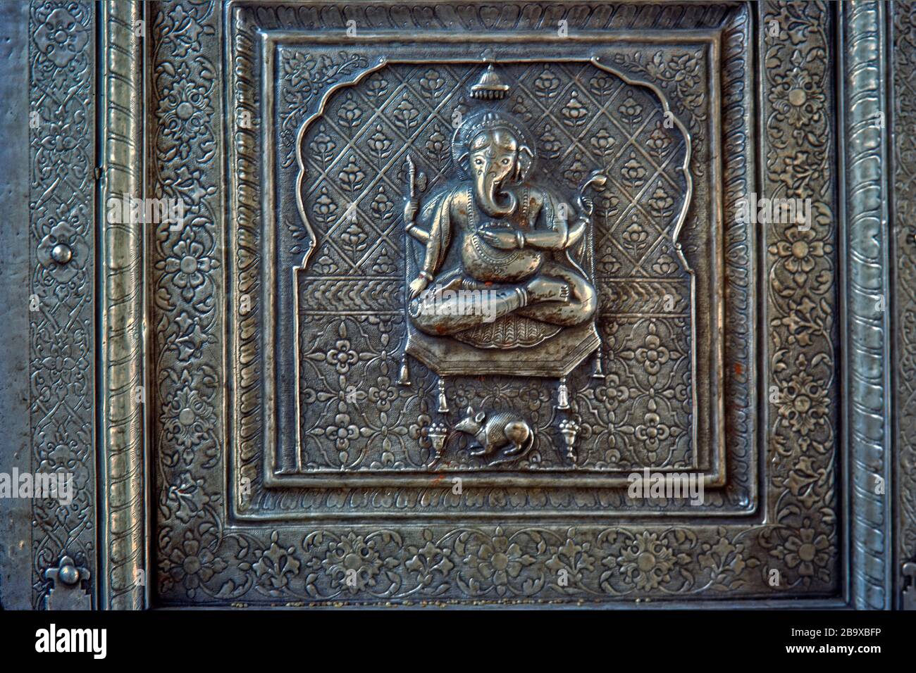 25 Mar 2020 Ganesh Idol embossed on silver door of Karni Mata Rat temple  Deshnoke; Bikaner ; Rajasthan ; India Stock Photo