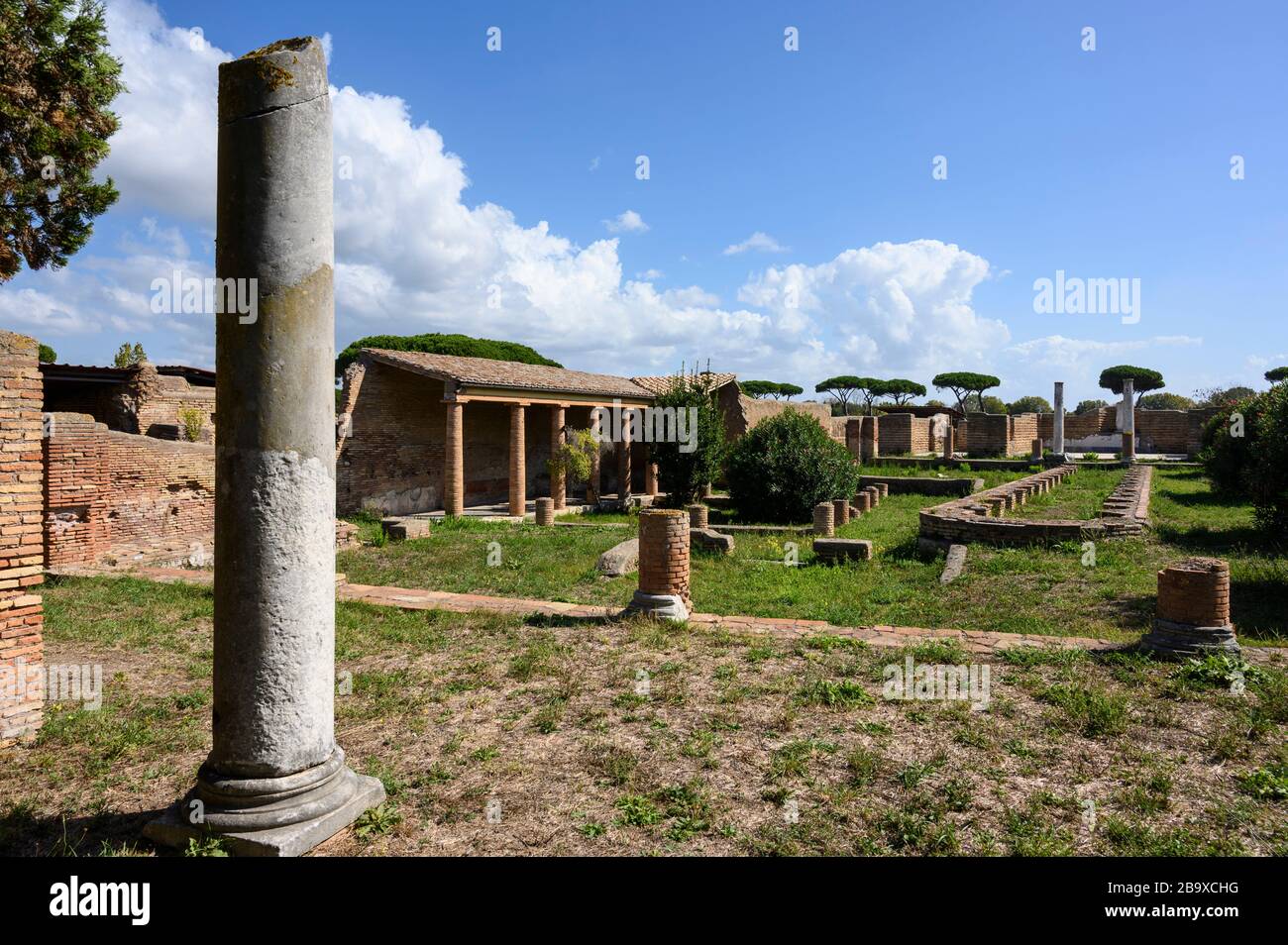 Rome. Italy. Ostia Antica. Remains of the Schola di Traiano (Schola Traianea / Guild-seat of Trajan).View of the long, narrow basin with semicircular Stock Photo