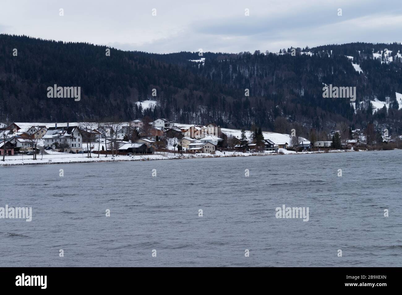 View of the Lac de Joux (Lake Joux) and the Vallée de Joux in L'Abbaye in Switzerland in winter. Stock Photo