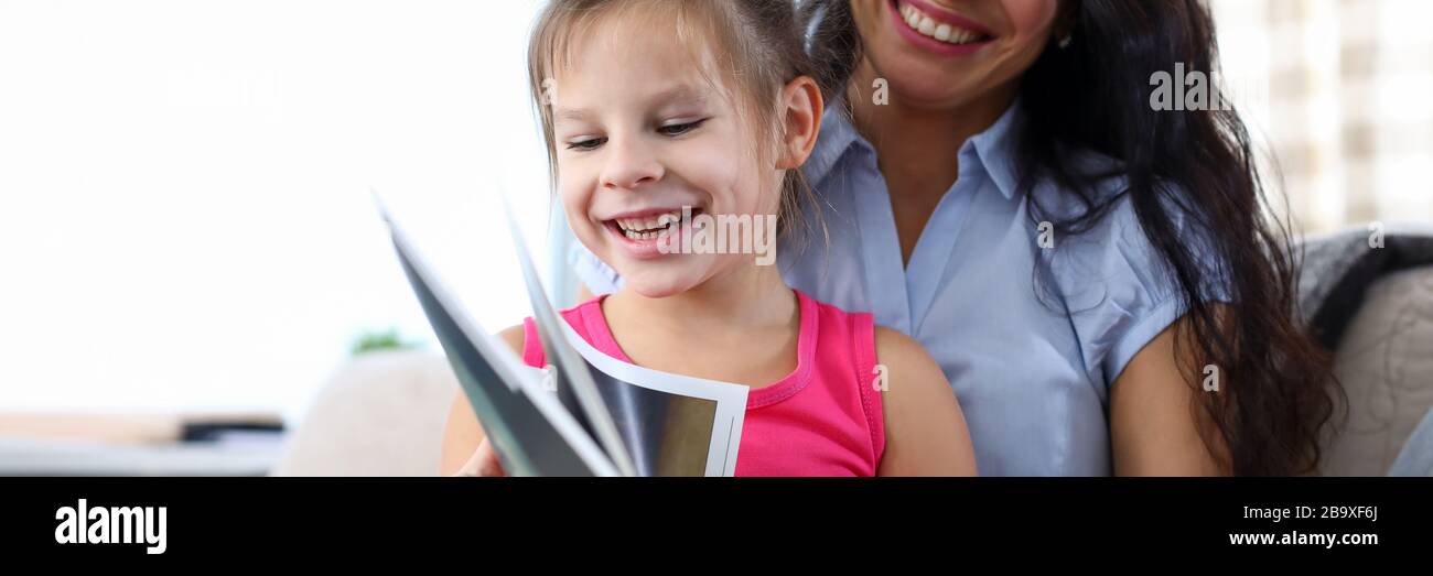 Mum reading book with child Stock Photo