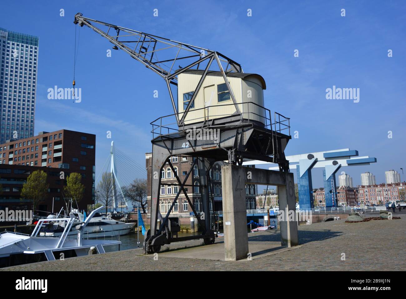 Historic Binnenhaven of Rotterdam; former harbor and poortgebouw restored in old glory in combination with urban living and marina Stock Photo