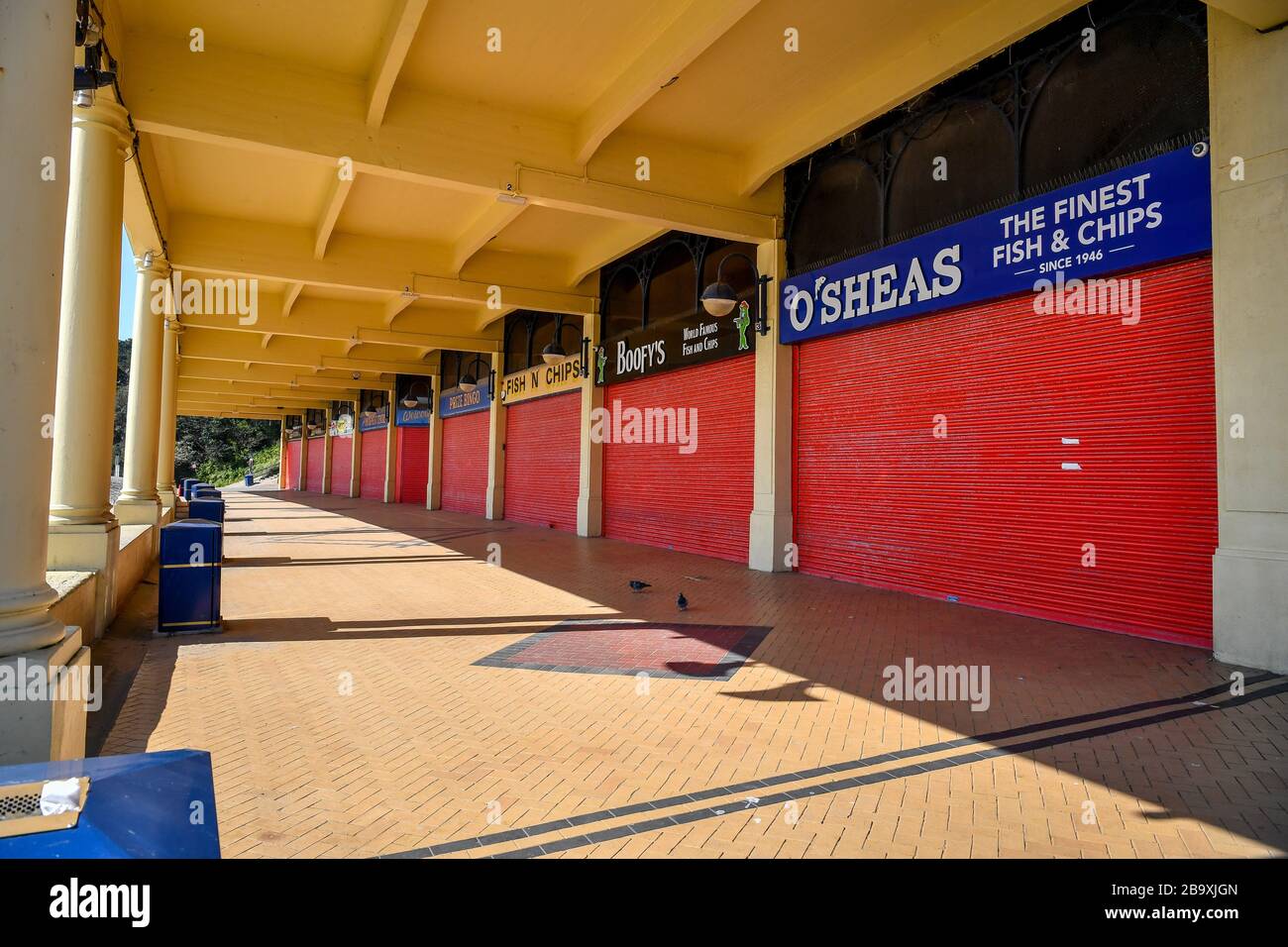 Traditional seaside shops and amusements are closed and devoid of people in Barry Island, Wales after Prime Minister Boris Johnson has put the UK in lockdown to help curb the spread of the coronavirus. Stock Photo