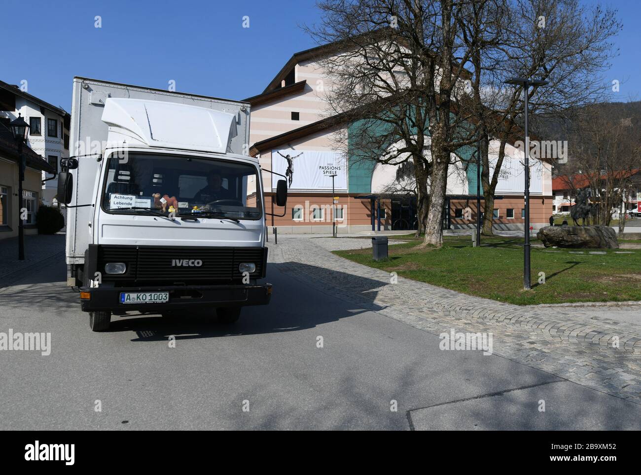 Oberammergau, Germany. 24th Mar, 2020. The owner Elke Kerler picks up the animal passion actors, the Catalan giant donkey Sancho and two camels, with the transporter. After the cancellation of the Oberammergau Passion Plays, the animal actors have been released from their roles for the time being. Credit: Angelika Warmuth/dpa/Alamy Live News Stock Photo