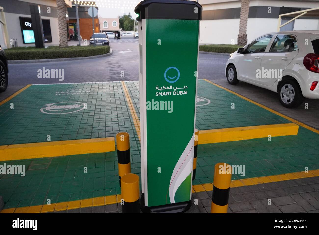 Smart Dubai car charging stations in parking lot. Charging modern