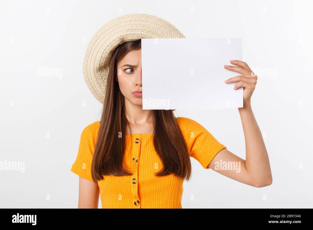 Afraid Paper Young caucasian woman holding blank paper sheet over isolated ...