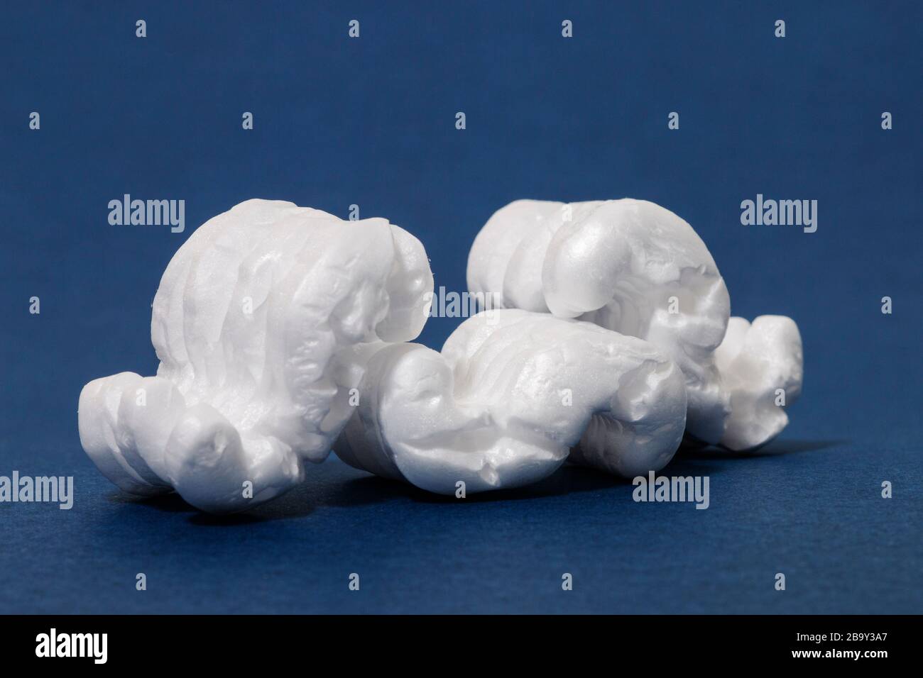 Polystyrene or white styrofoam packing pieces used for minimize bumps ...