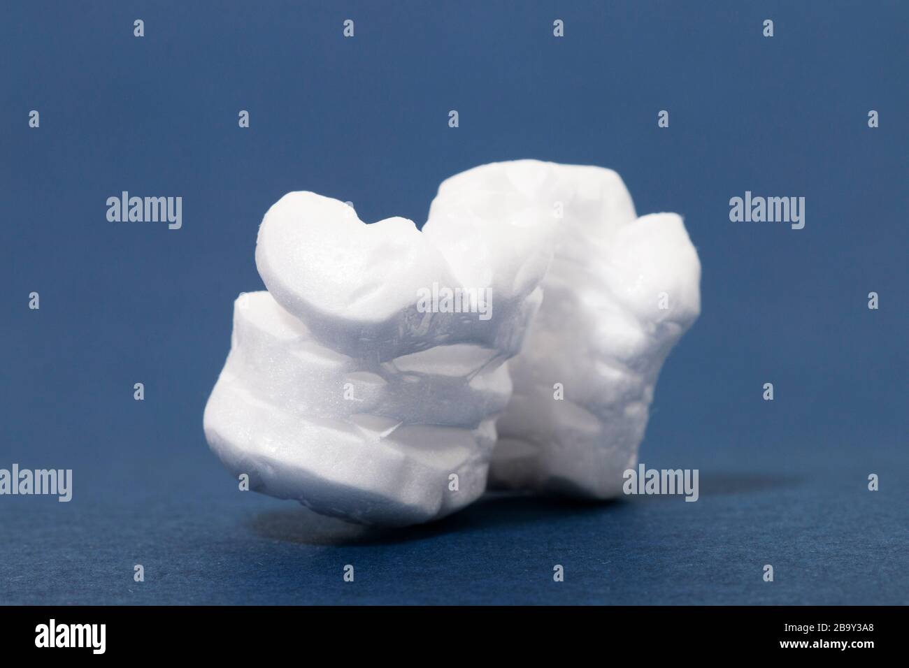 Polystyrene or white styrofoam packing pieces used for minimize bumps ...
