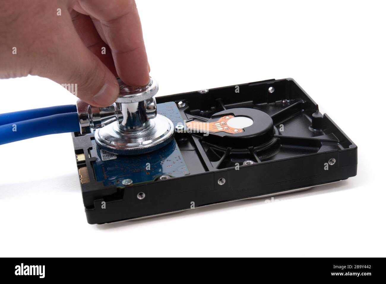 Stethoscope and hard disk drive isolated on a white background. Stock Photo