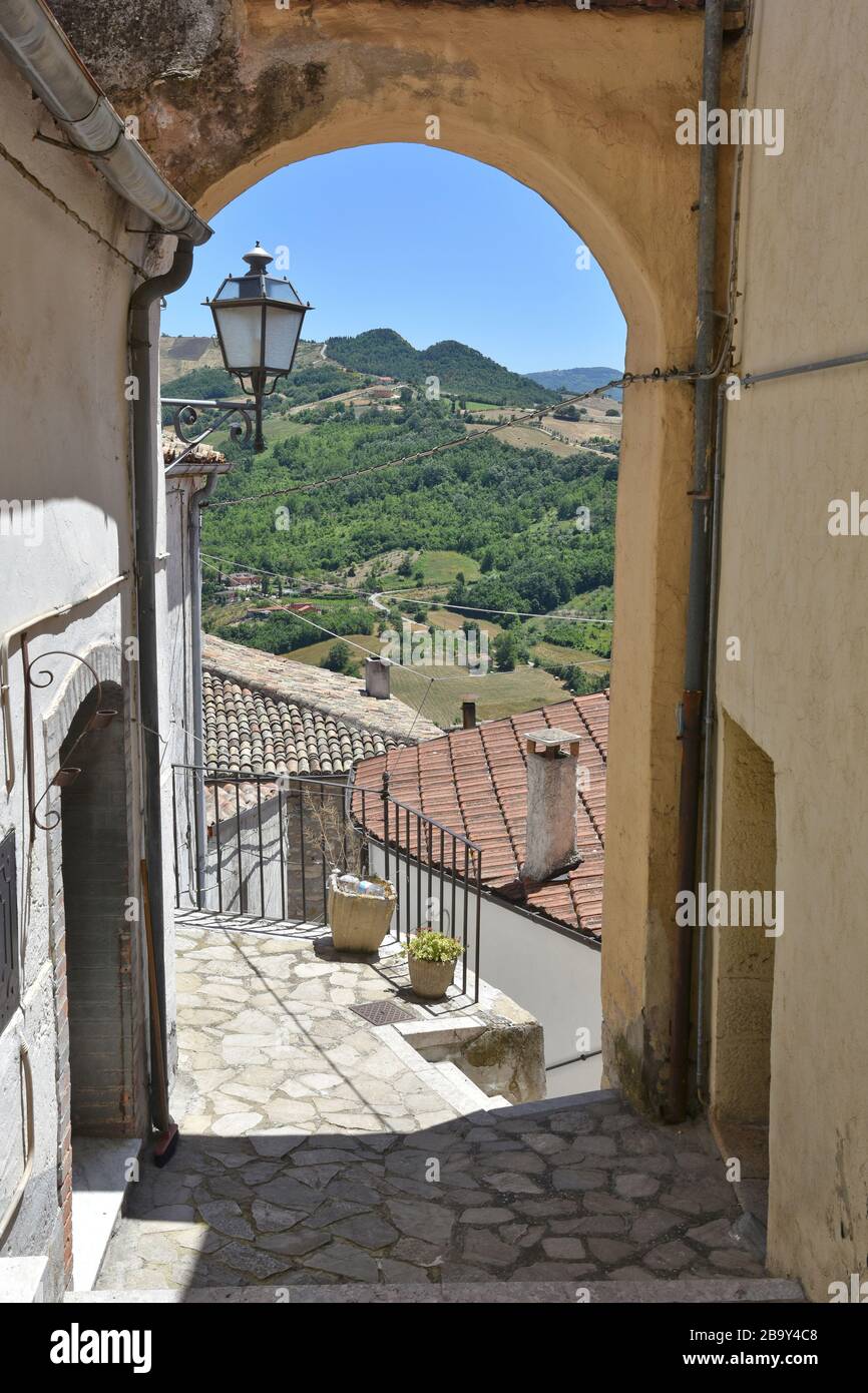A narrow street among the old zungoli houses, a medieval village in the