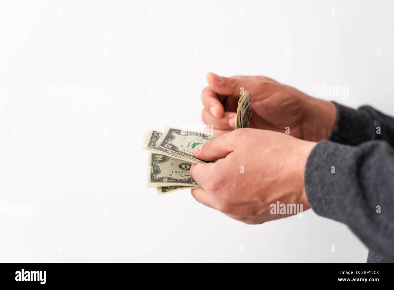 Hands are counting cash money for taking from or giving to someone. financial, payment concept Stock Photo