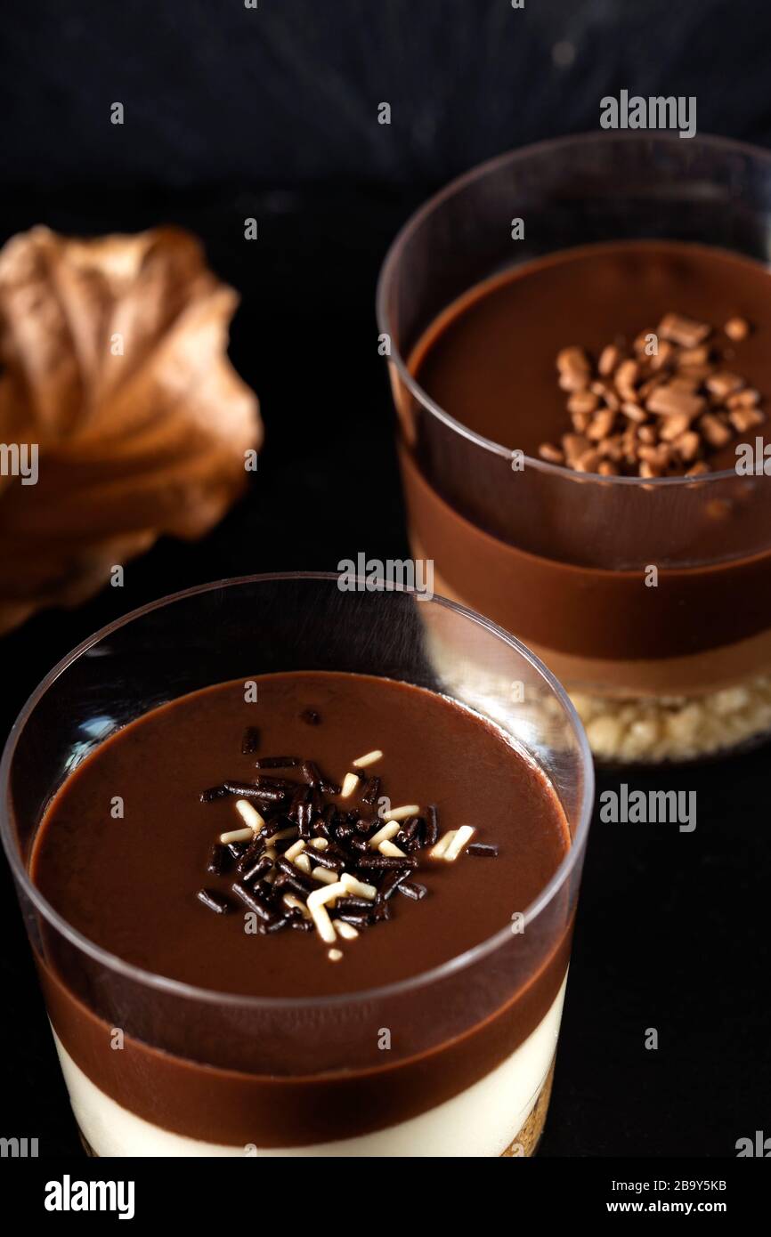Chocolate dessert in glasses on a dark slate Stock Photo