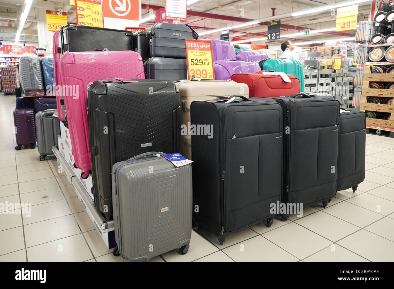 Department store interior view with luggage zone. Multicolored Suitcases in  store for sale. Plastic and Cloth Suitcases with discount tags. Concept of  Stock Photo - Alamy