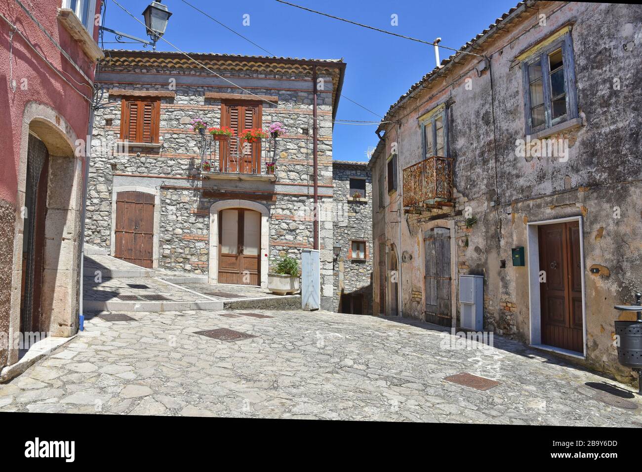 A narrow street between the old houses of Zungoli, a medieval village