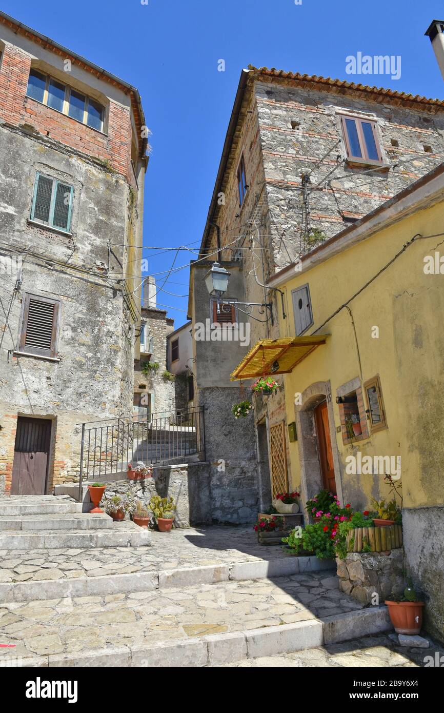 A narrow street between the old houses of Zungoli, a medieval village