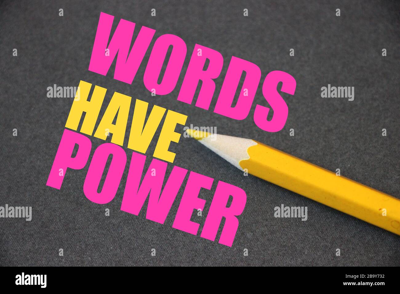 The phrase Words Have Power written with yellow pencil on texturized