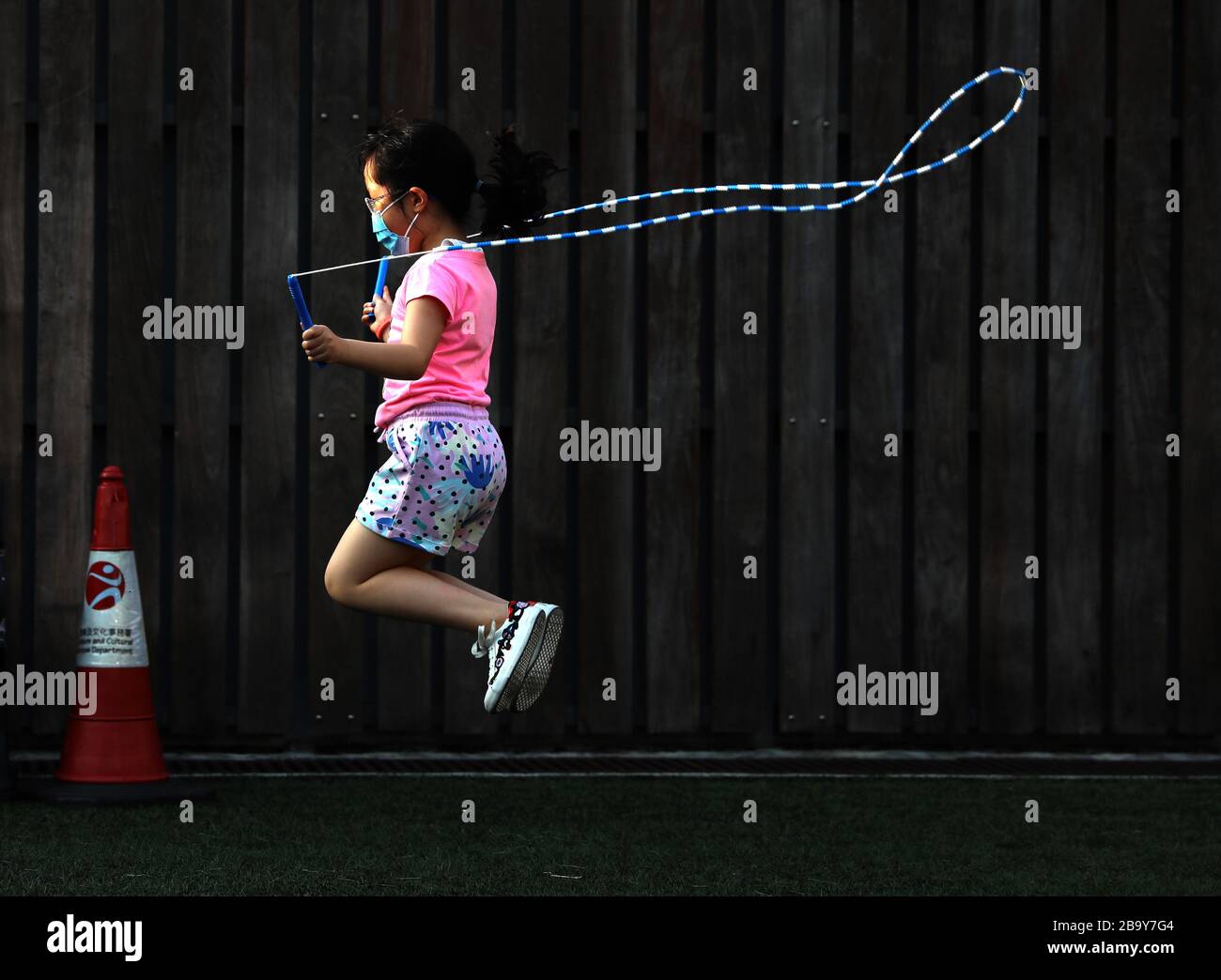 Jump Rope Hk Hong Kong, China. 24th Mar, 2020. A child jumps rope in Wan Chai of ...