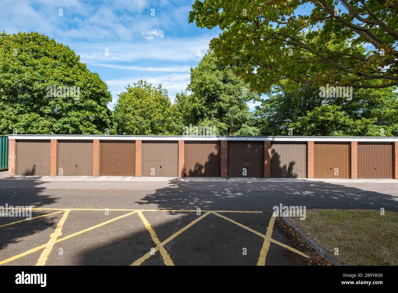 9 lock up garages on an housing estate in Crewe Cheshire UK Stock Photo