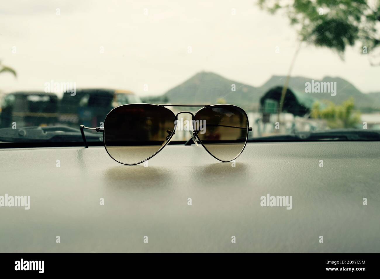 View of sunglasses on the car dashboard Stock Photo Alamy