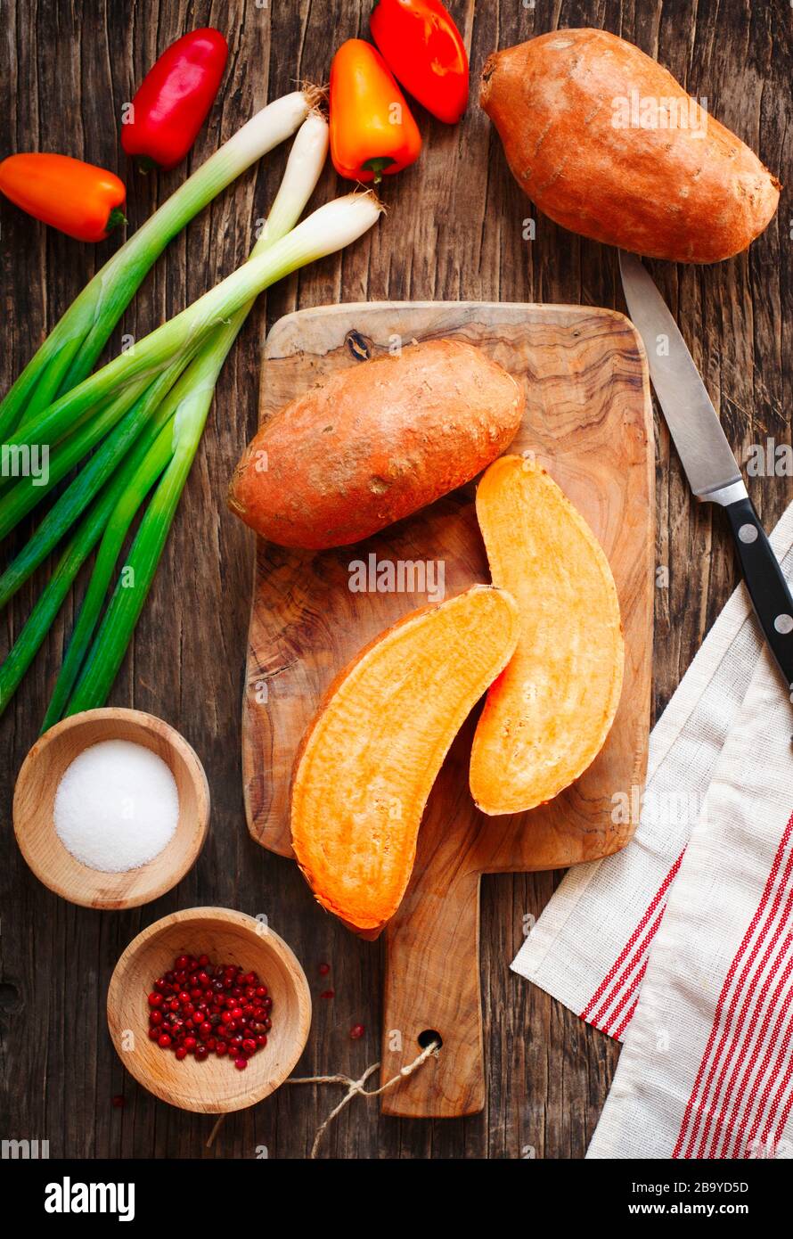 Preparing sweet potato for cooking Stock Photo - Alamy