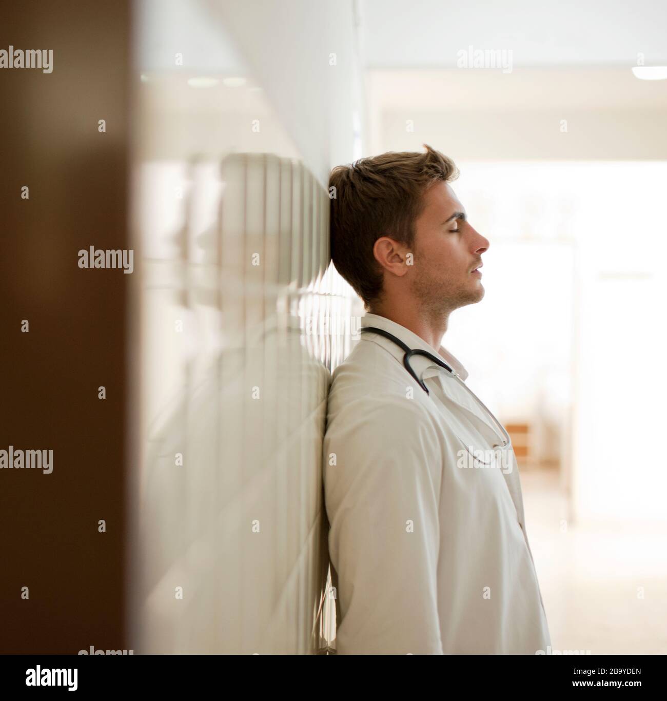 Stressed male doctor in hi-res stock photography and images - Alamy
