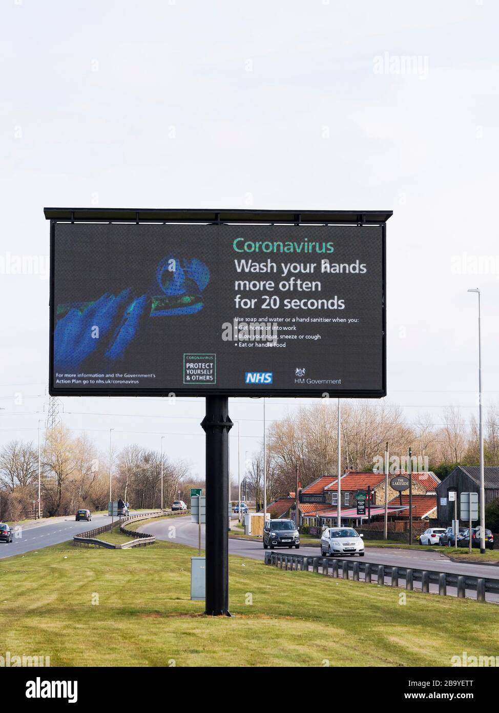 Gateshead, South Tyneside, UK. Road sign reminding UK citizens to handwash. 22nd March 2020 Stock Photo