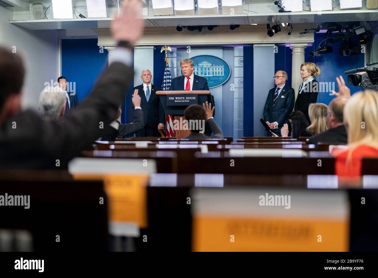 Washington, United States Of America. 24th Mar, 2020. Washington, United States of America. 24 March, 2020. U.S President Donald Trump addresses reporters at the Coronavirus Task Force briefing in the Press Briefing Room of the White House March 24, 2020 in Washington, DC. Amb. Deborah Birx, White House Coronavirus Task Force Response Coordinator, Larry Kudlow, Director of the National Economic Council and Dr. Anthony Fauci, Director, National Institute of Allergy and Infectious Diseases look on. Credit: Andrea Hanks/White House Photo/Alamy Live News Stock Photo