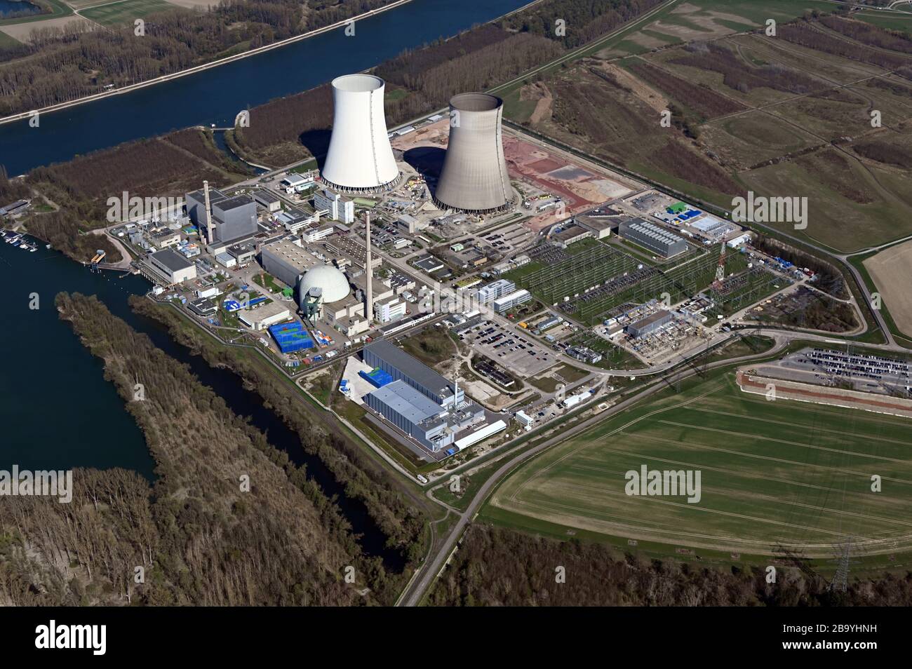 24 March 2020, Baden-Wuerttemberg, Philippsburg: Aerial view of Philippsburg nuclear power plant. The energy provider EnBW wants to have the two cooling towers of the nuclear power plant blown up on 14 May 2020 at the earliest. The actual date, however, is completely open and also depends on the development of the corona pandemic, the company announced on Tuesday. The application for approval of the work had now been submitted to the Ministry of the Environment and an earliest possible date had to be specified. Block 2 of the nuclear power plant was finally taken off the grid at the turn of th Stock Photo