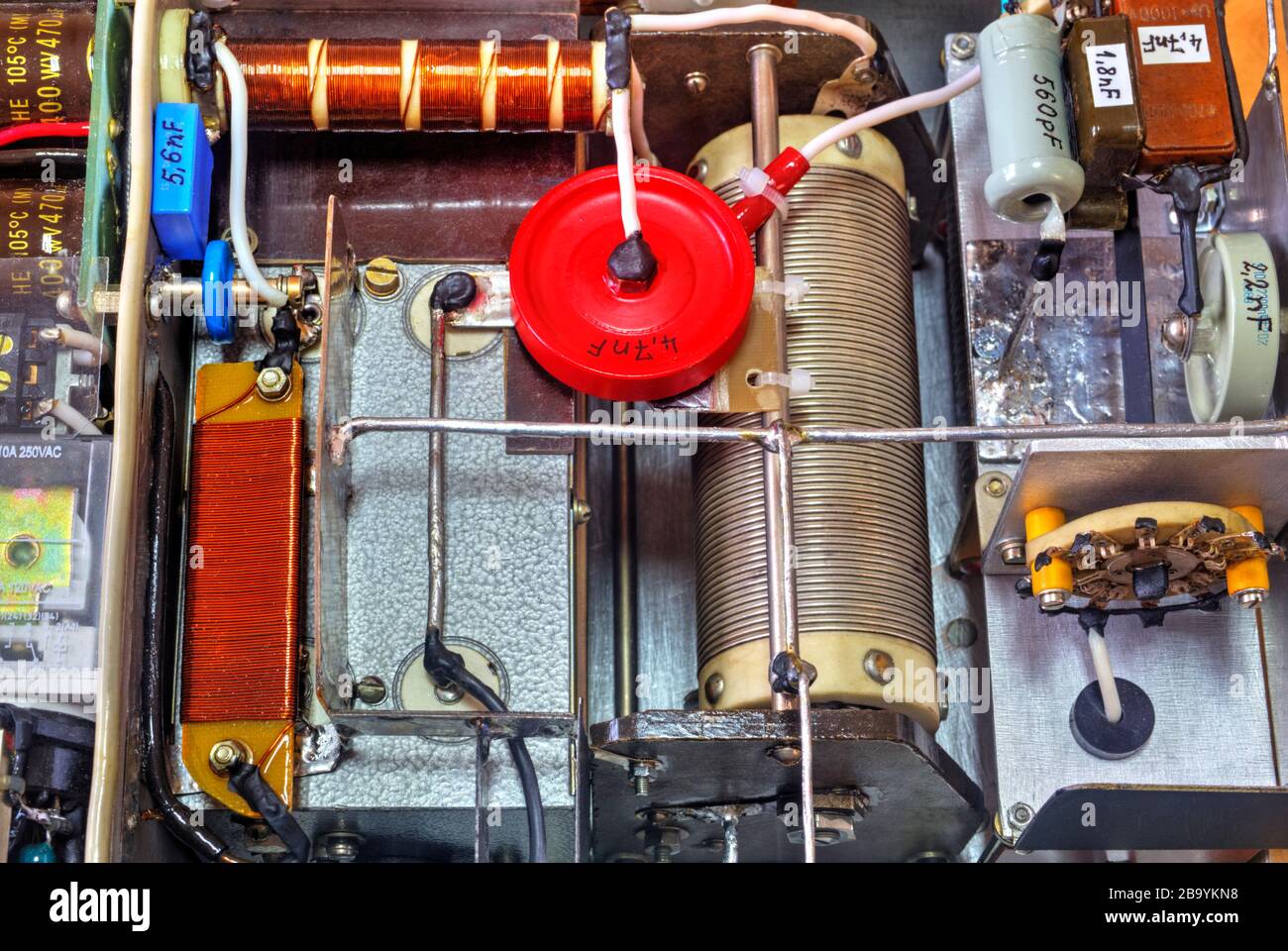 Inside view of high frequency power amplifier with capacitors, coils