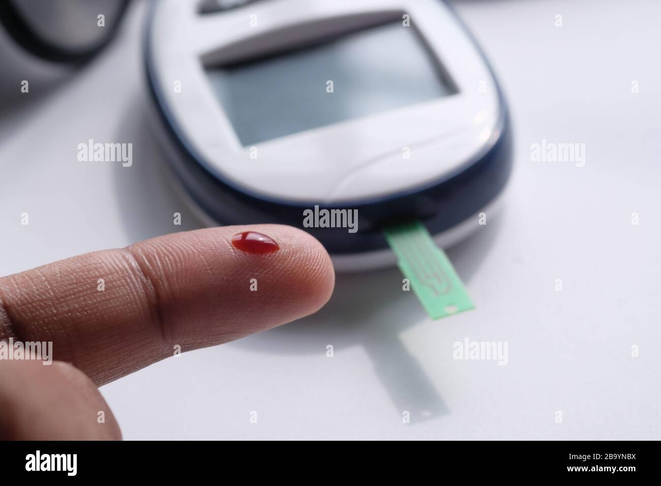 Men finger with blood measuring blood sugar diabetes Stock Photo Alamy
